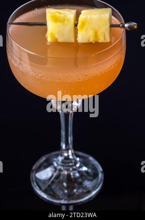 Only fans Martini cocktail garnished with pineapple cubes Stock Photo