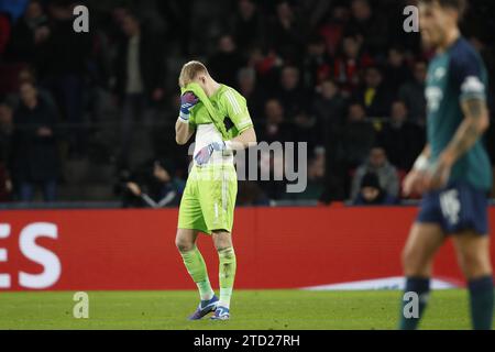 EINDHOVEN - Arsenal FC goalkeeper Aaron Ramsdale is disappointed during the UEFA Champions League Group B match between PSV Eindhoven and Arsenal FC at the Phillips Stadium on December 12, 2023 in Eindhoven, Netherlands. ANP | Hollandse Hoogte | Bart Stoutjesdijk Stock Photo