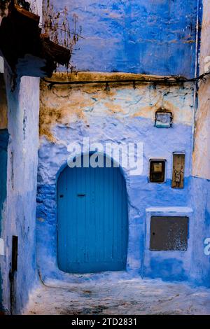 Typical old street with blue painted walls and doors in the medina of Chefchaouen, Morocco Stock Photo