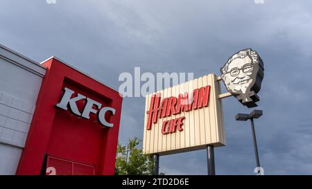 KFC and Harman Cafe sign at its World's First KFC (Kentucky Fried Chicken) restaurant in Salt Lake City, Utah, USA. Stock Photo
