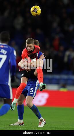 Mark McGuinness of Cardiff City (r) &Jay Stansfield of Birmingham City (28) in action. EFL Skybet championship match, Cardiff city v Birmingham City at the Cardiff City Stadium in Cardiff ,Wales on Wednesday 13th December 2023. this image may only be used for Editorial purposes. Editorial use only, pic by  Andrew Orchard/Andrew Orchard sports photography/Alamy Live news Stock Photo