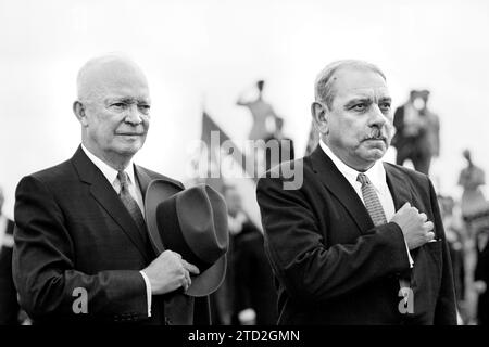 U.S. President Dwight D. Eisenhower and Puerto Rican Governor Luis Muñoz Marín, standing with  hands over their hearts, with San Juan, Puerto Rico, Marion S. Trikosko, U.S. News & World Report Magazine Photograph Collection, February 1960 Stock Photo