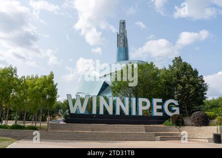 WINNIPEG Sign with Canadian Museum for Human Rights in the background in Winnipeg, Manitoba, Canada Stock Photo