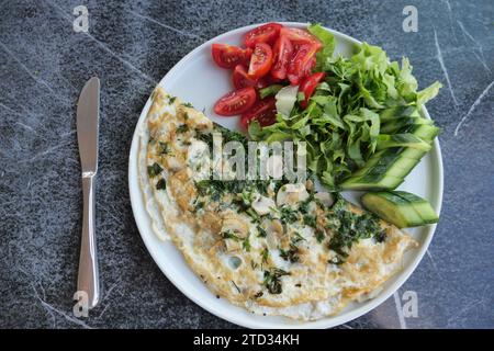 top view of herb Egg Omelette on table  Stock Photo
