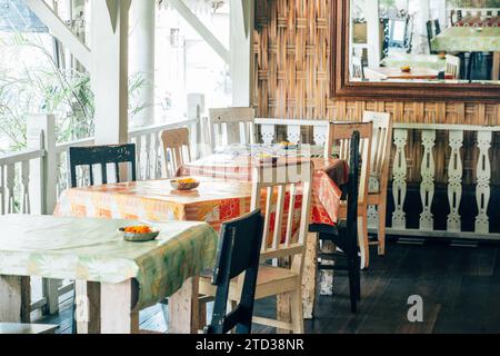 Neatly set table with utensils and plates, ready for a meal. Stock Photo