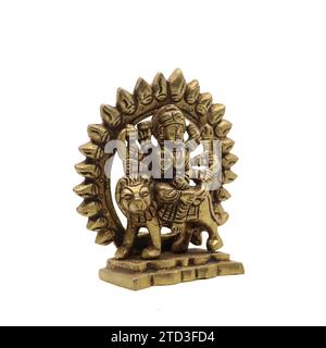 statue of goddess durga devi of hindu religion holding multiple weapons in her many arms, sitting on her lion Stock Photo