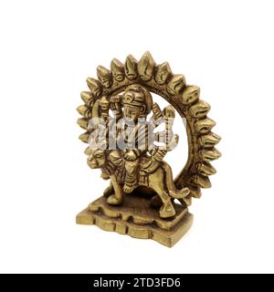 statue of goddess durga devi of hindu religion holding multiple weapons in her many arms, sitting on her lion Stock Photo