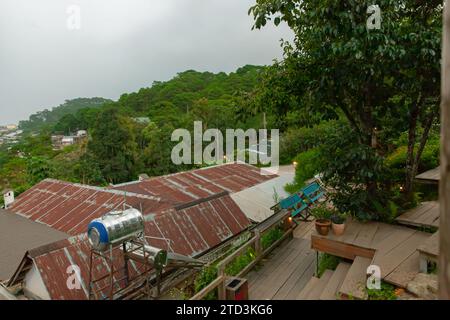 Top view of old houses with rusty metal roof in cloudy day Stock Photo