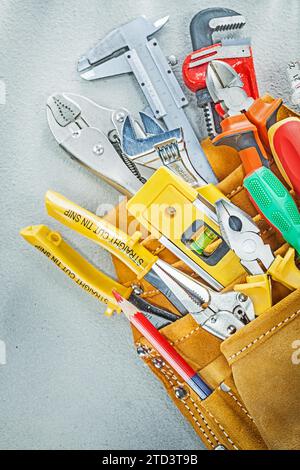 Set of construction tooling in leather tool belt Stock Photo