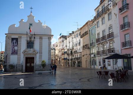 Capela de Nossa Senhora da Saude, on the right Old town houses in Rua da Mouraria, Lisbon, Portugal Stock Photo