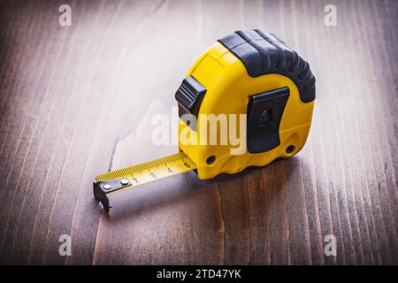Yellow wallpaper on vintage wooden board construction concept Stock Photo