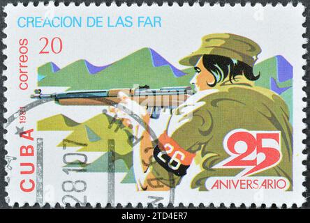 Cancelled postage stamp printed by Cuba, that shows Marksman, 25th anniversary of the revolution, circa 1981. Stock Photo