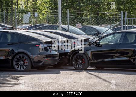 M?lndal, Sweden - May 26 2022: New black Tesla Model Y electric cars almost ready to be delivered. Stock Photo