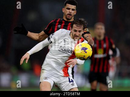 Luton Town's Tom Lockyer (front) and Bournemouth's Dominic Solanke battle for the ball during the Premier League match at the Vitality Stadium, Bournemouth. Picture date: Saturday December 16, 2023. Stock Photo