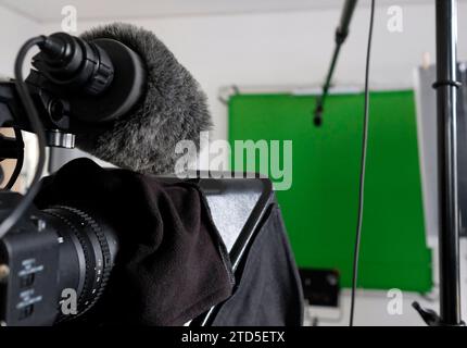 Setup in a TV studio with green screen, lights, and camera Stock Photo