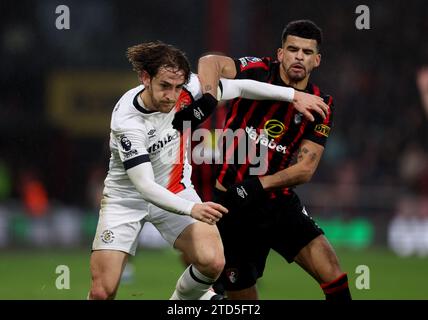 Luton Town's Tom Lockyer (left) and Bournemouth's Dominic Solanke battle for the ball in the first half of the Premier League match at the Vitality Stadium, Bournemouth. Picture date: Saturday December 16, 2023. Stock Photo