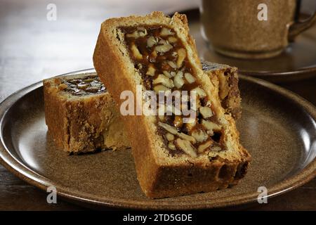 Engadine walnut cake on coffee table Stock Photo