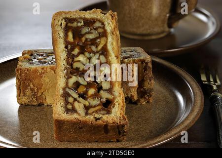 Engadine walnut cake on coffee table Stock Photo