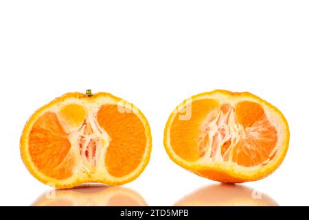 Two halves of juicy fresh tangerine, macro, isolated on white background. Stock Photo