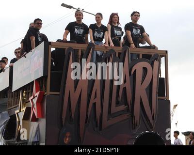 The casts of the horror film, 'MALLARI' headed by actors JC Santos, Elisse Joson and Janella Salvador in their float. The Metro Manila Film Festival (MMFF) Parade of Stars kicks-off at the Navotas Centennial Park and will end at Valenzuela People's Park. The grand float parade will traverse four cities for the first time in it's parade history. Stock Photo