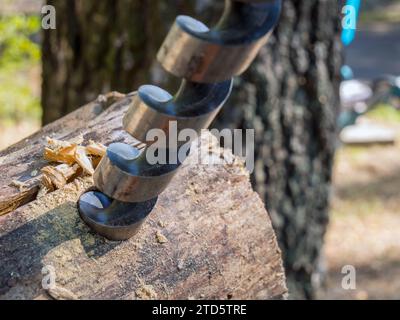 Drilling a hole in a log with a drill for wood Stock Photo