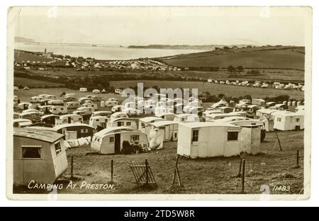 Original 1950's era postcard of a busy caravan park /campsite at Preston, near Weymouth, Dorset, U.K. dated /  posted August 1952 Stock Photo