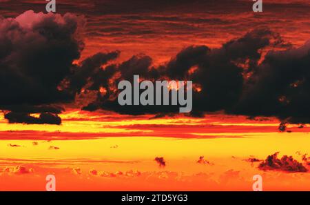 dramatic cloudy sky at fiery sunset Stock Photo