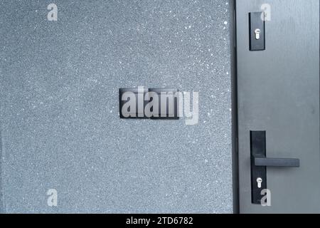 double electric switch on black concrete wall Stock Photo