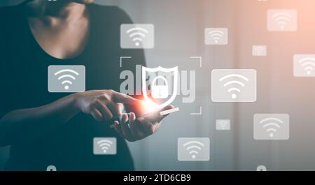 Social network Wifi business button locked shield security virus icon, Woman hand hold smartphone with Keys and wifi in home, cyber security Stock Photo