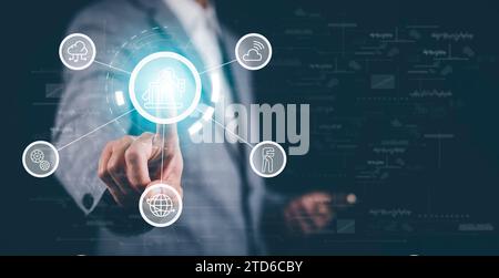 Smart industry concept with businessman on blurred abstract background,Businessman touch industry with industrial graphic mark and blue tone of automa Stock Photo