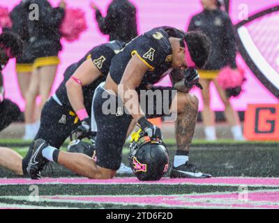 December 16, 2023: Appalachian State running back Ahmani Marshall (3) kneels in prayer before NCAA football game in the Avocados from Mexico Cure Bowl between Appalachian State Mountaineers and Miami RedHawks at FBC Mortgage Stadium in Orlando, FL. Romeo T Guzman/Cal Sport Media Stock Photo