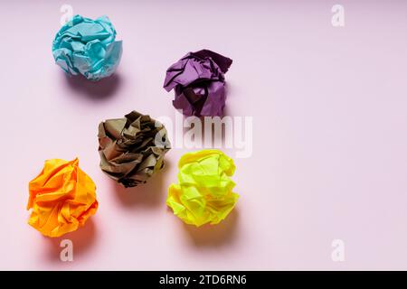 Crumpled Paper Balls on Pink Background, Mental Instability Concept Stock Photo