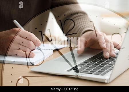 Time concept. Double exposure of man using laptop while taking notes and clock Stock Photo