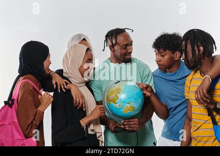 A diverse group of students is gathered around a globe, engrossed in exploration and study, their vibrant energy captured against a pristine white Stock Photo