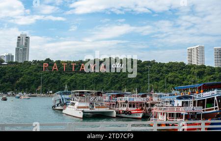 Pattaya, Thailand - December 15, 2023: Pattaya City Sign, hillside landmark featuring town name in giant letters. view from ferry at bali hai pier. Stock Photo