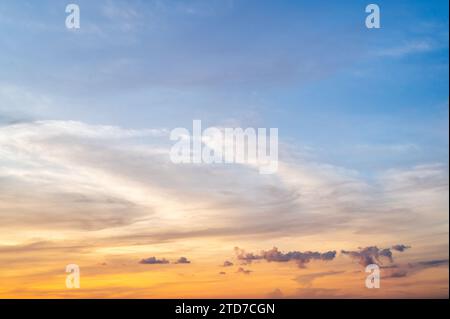 Fluffy clouds at sunset. Sunset Sunrise Sundown Sky with colorful clouds. Evening, Colorful sunset sky background in Golden Sky Hour with Romantic Ora Stock Photo