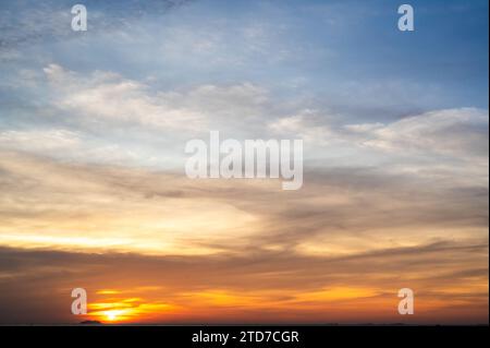 Majestic sunset. orange sunset sky with bright sun. Dramatic sky at sunset. sunset sky with multicolor clouds. Dramatic twilight sky background Stock Photo