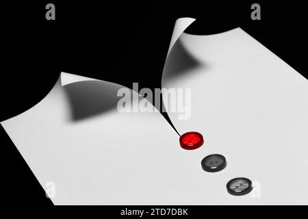 Abstract white shirt with a collar made from a sheet of paper on a black background. Formal wear, business and success concept Stock Photo