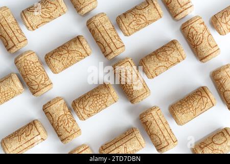 Wine corks laid out in a lattice pattern on a white background. Stock Photo