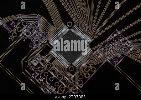 An overhead view of a printed circuit board with a microprocessor, with a negative image effect. Macro photography Stock Photo