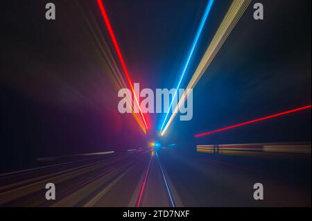 Long exposure with the train through the night past signals Stock Photo