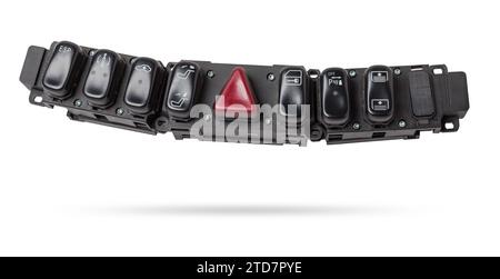 Black plastic block of car control panel with red emergency stop button for signal lights, spare part on a white isolated background in a photo studio Stock Photo