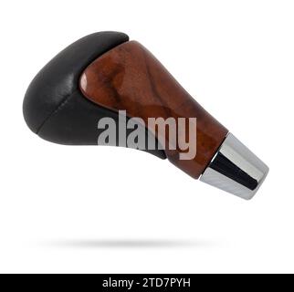 Wooden and leather handle for shifting automatic gears of the car. Decorative details on a black background. Stock Photo