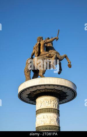 The statue of Alexander the Great - officially Warrior on a Horse - on Macedonia Square in central Skopje, the capital of North Macedonia. Stock Photo