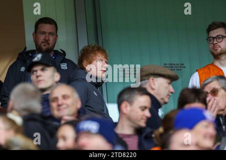 Ipswich, England, UK. 16th Dec, 2023. Ed Sheeran takes his seat during the Ipswich Town FC v Norwich City FC sky bet EFL Championship match at Portman Road, Ipswich, England, United Kingdom on 16 December 2023 Credit: Every Second Media/Alamy Live News Stock Photo