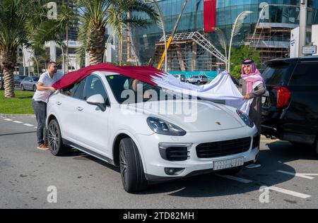 Qatar National Day Celebration. Flying Flag on Car Stock Photo