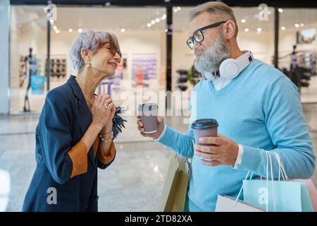 Retired people spending time in city shopping center Stock Photo
