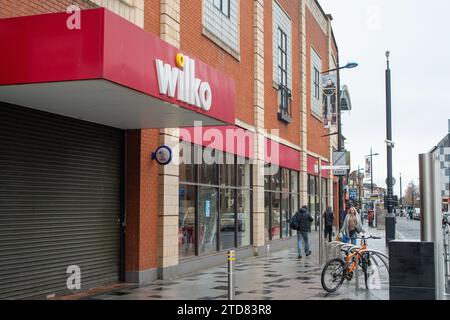 Slough, Berkshire, UK. 16th December, 2023. A closed down Wilko store in Slough High Street. People were out doing their Christmas shopping in Slough, Berkshire today. The town is quieter than it used to be as part of the shopping centre, Queensmere, has been closed down awaiting redevelopment. Slough has recently been named Britain's ugliest and unhealthiest place to live in Britain. Credit: Maureen McLean/Alamy Live News Stock Photo