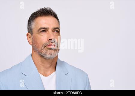 Serious thoughtful mid aged business man thinking isolated on white background. Stock Photo