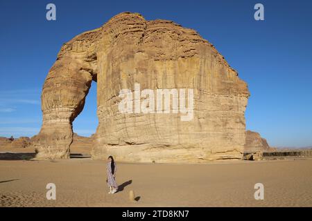 Tourist at Elephant Rock in the desert of Saudi Arabia Stock Photo